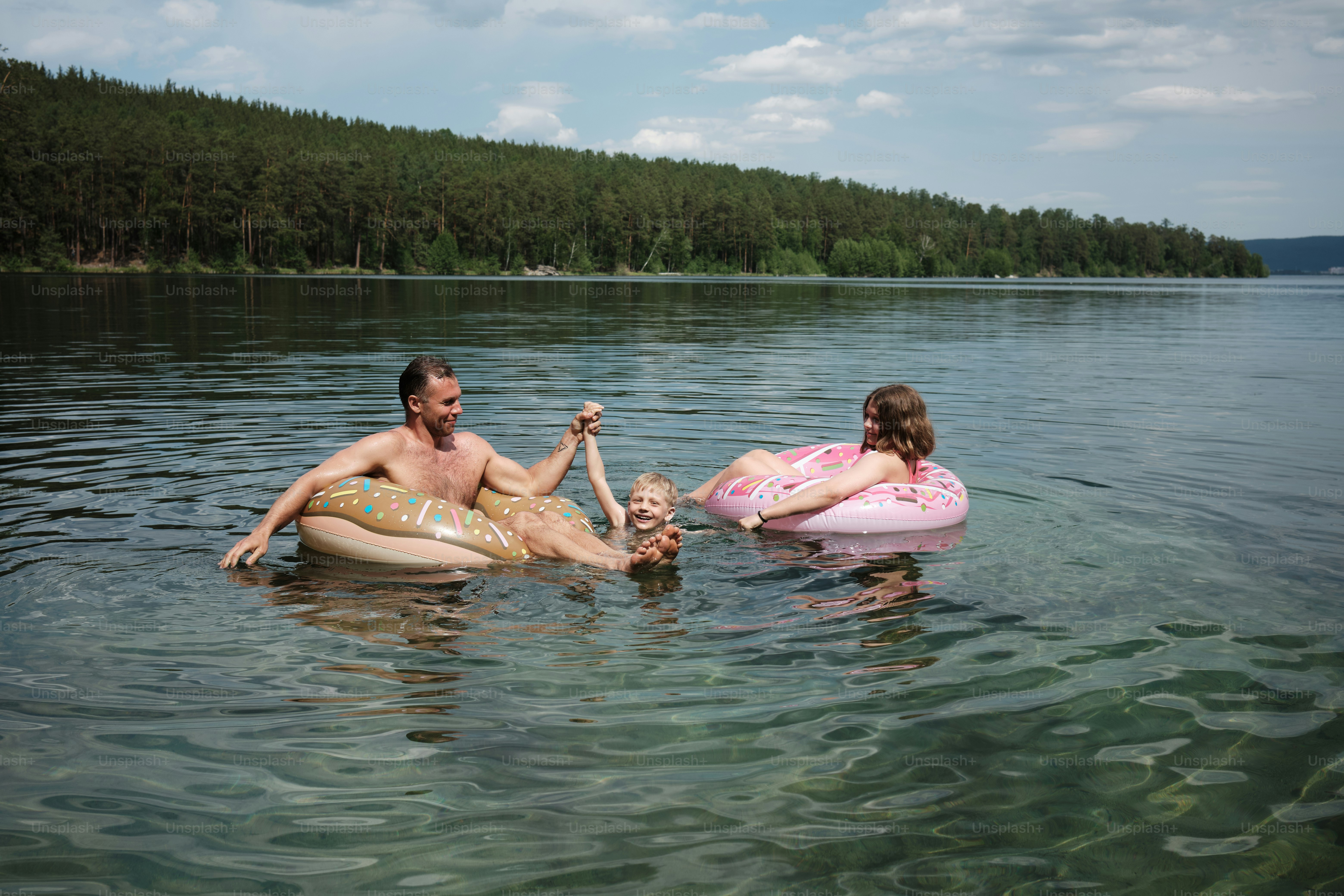 a man and a little girl are in the water