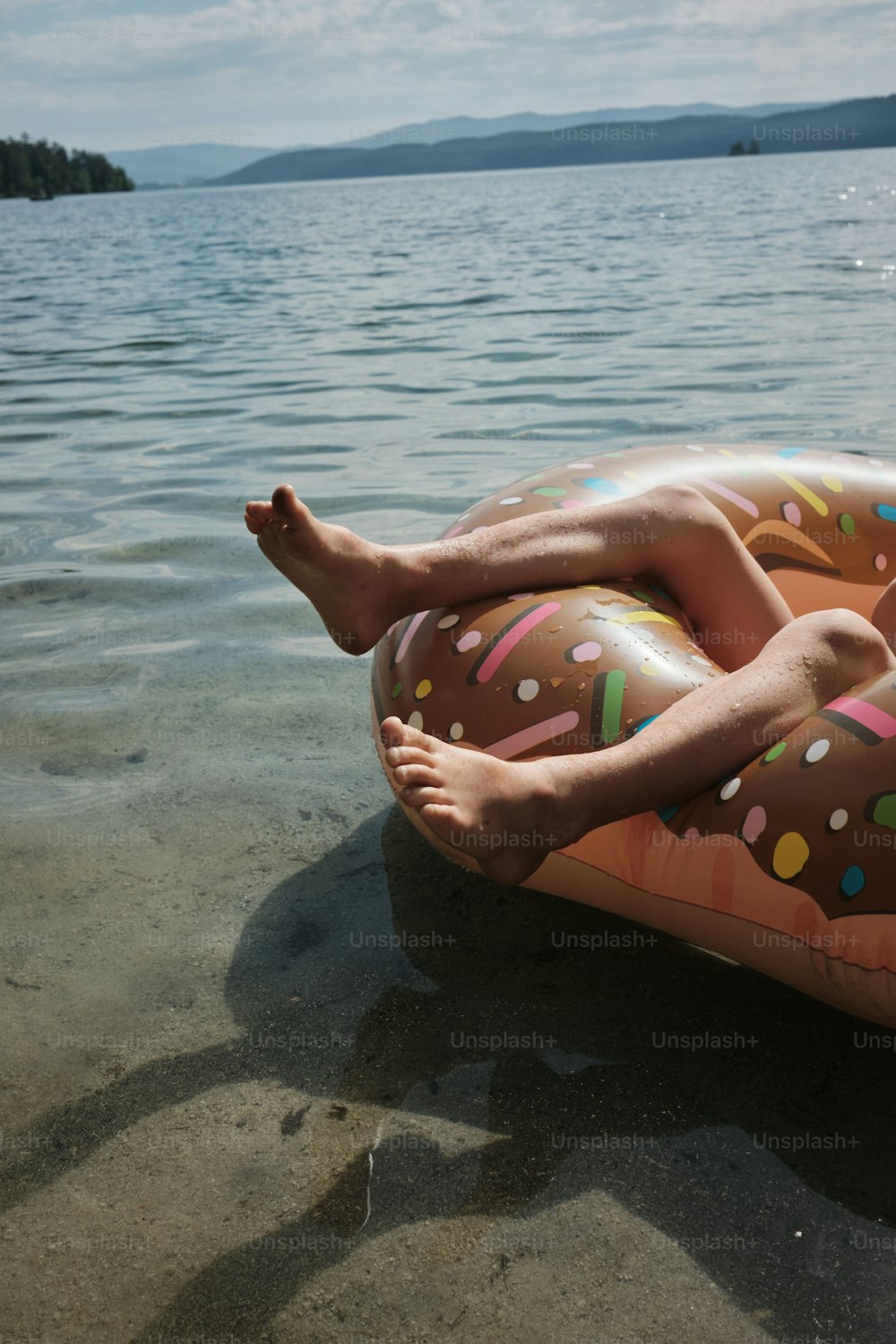 a man laying on an inflatable float in the water