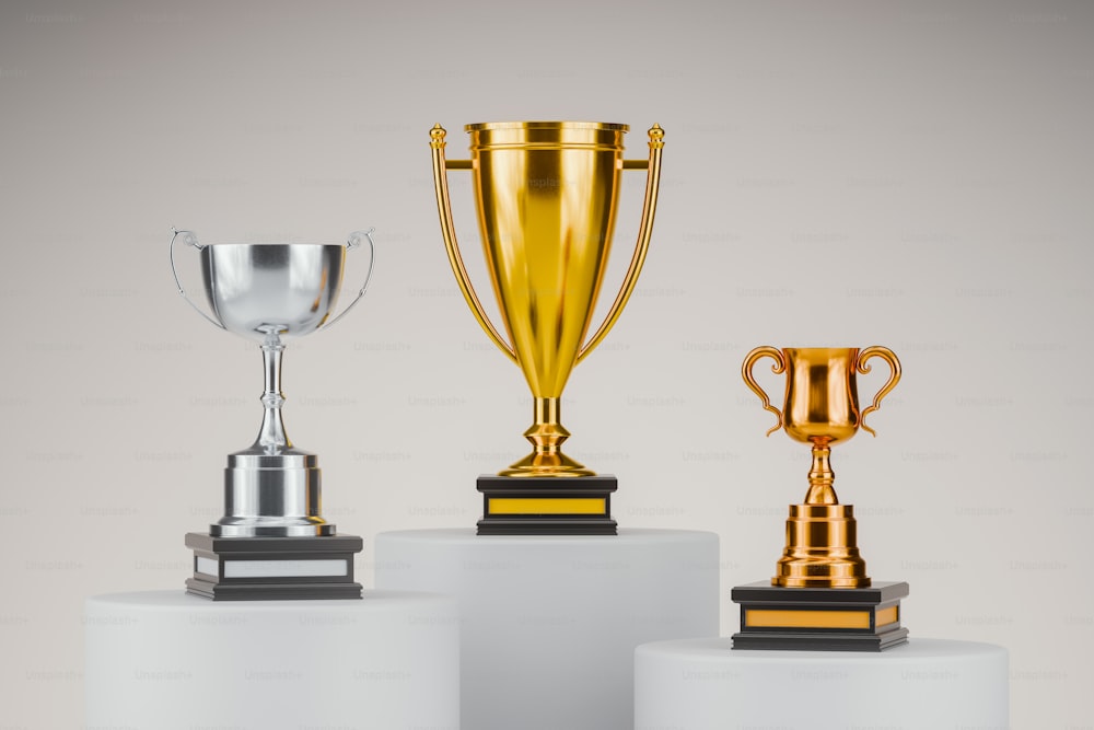 a group of three trophies sitting on top of each other