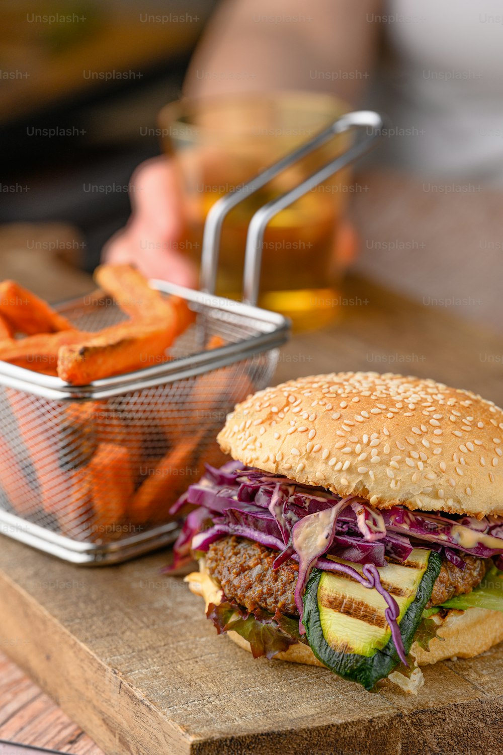 a hamburger with a side of sweet potato fries