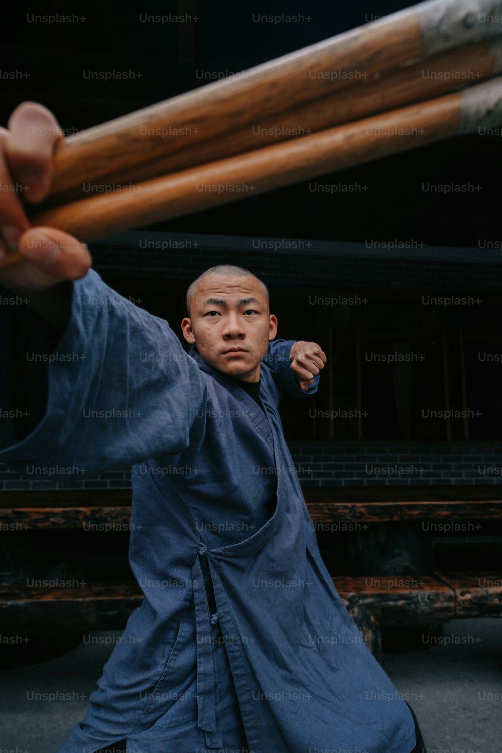 a man holding a baseball bat over his shoulder