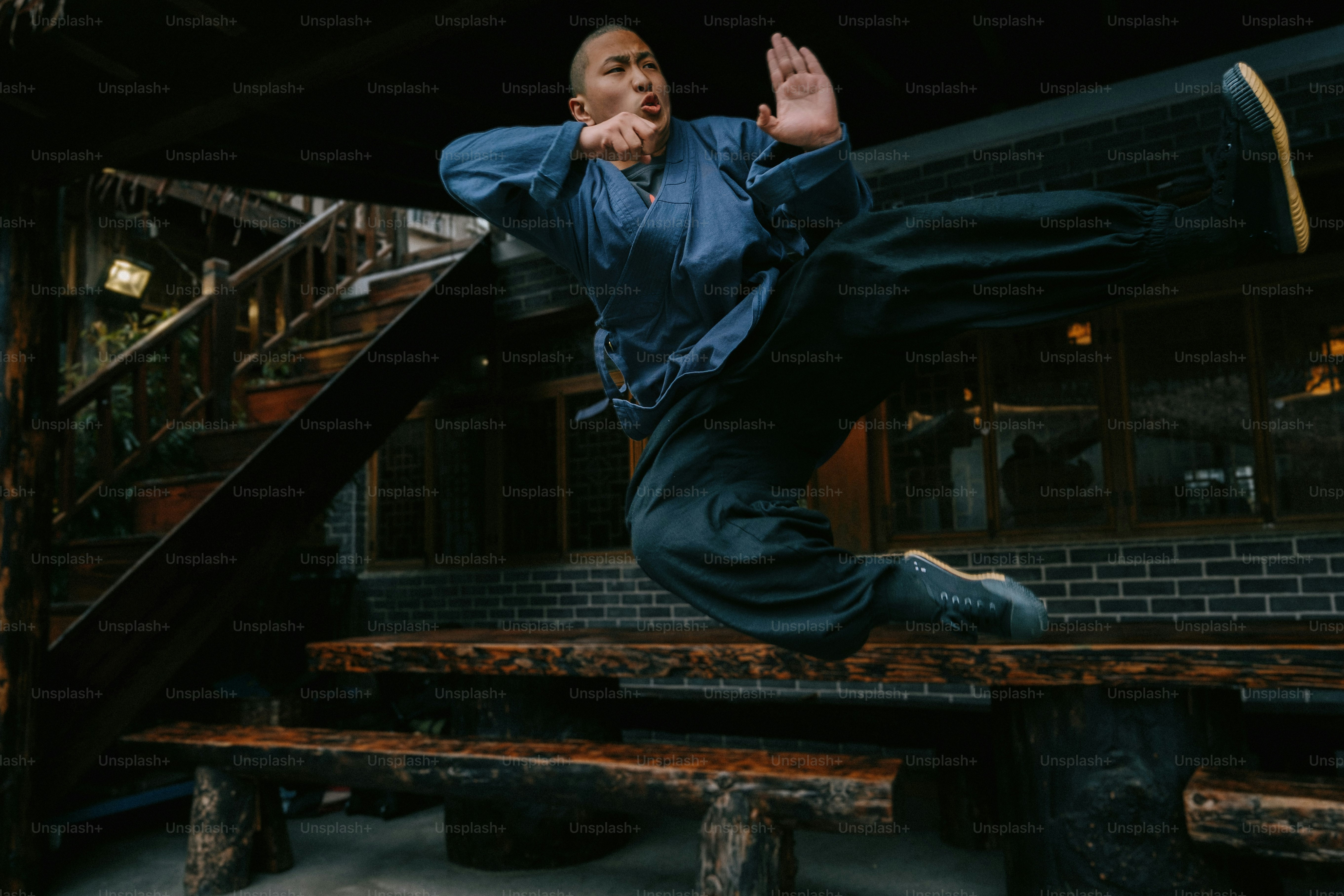 a man is doing a trick on a bench