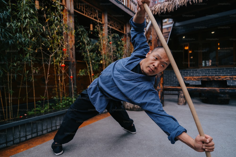 a man holding a pole in his hands