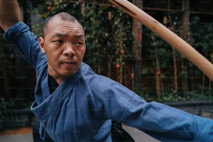 a man holding a baseball bat over his shoulder