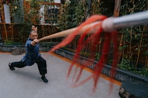 a man swinging a baseball bat at a ball