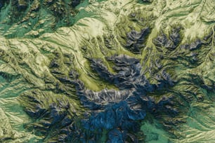 an aerial view of a green mountain range