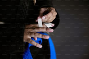 a person holding a pair of scissors in their hands