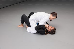 a man in a white shirt and a woman in a black suit