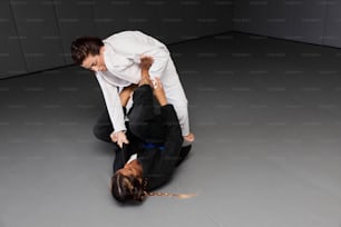 a man and a woman in business attire on the ground