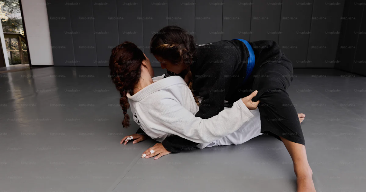 Karate Lay A couple of people that are laying on the ground photo – Martial arts ...
