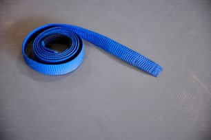 a blue strap laying on top of a table