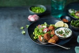 a plate of food on a table with a glass of water