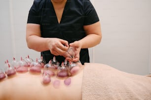 a woman getting a manicure at a spa