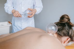 a woman getting a facial peel from a doctor
