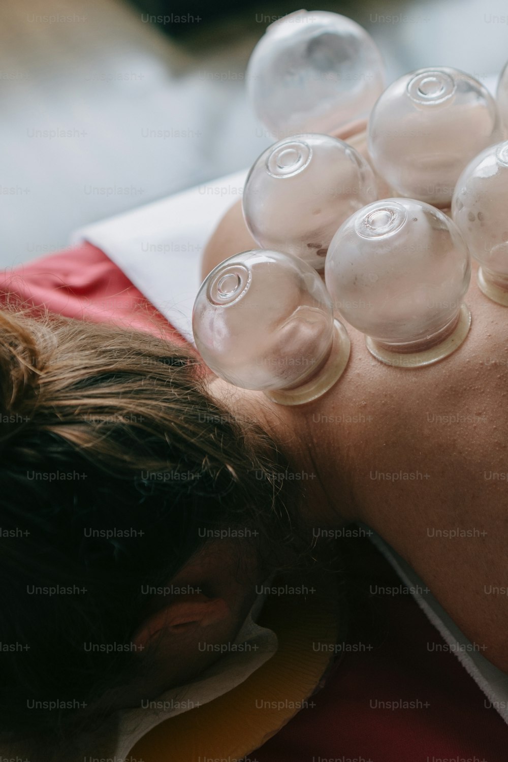a man laying down with a lot of bubbles on his back
