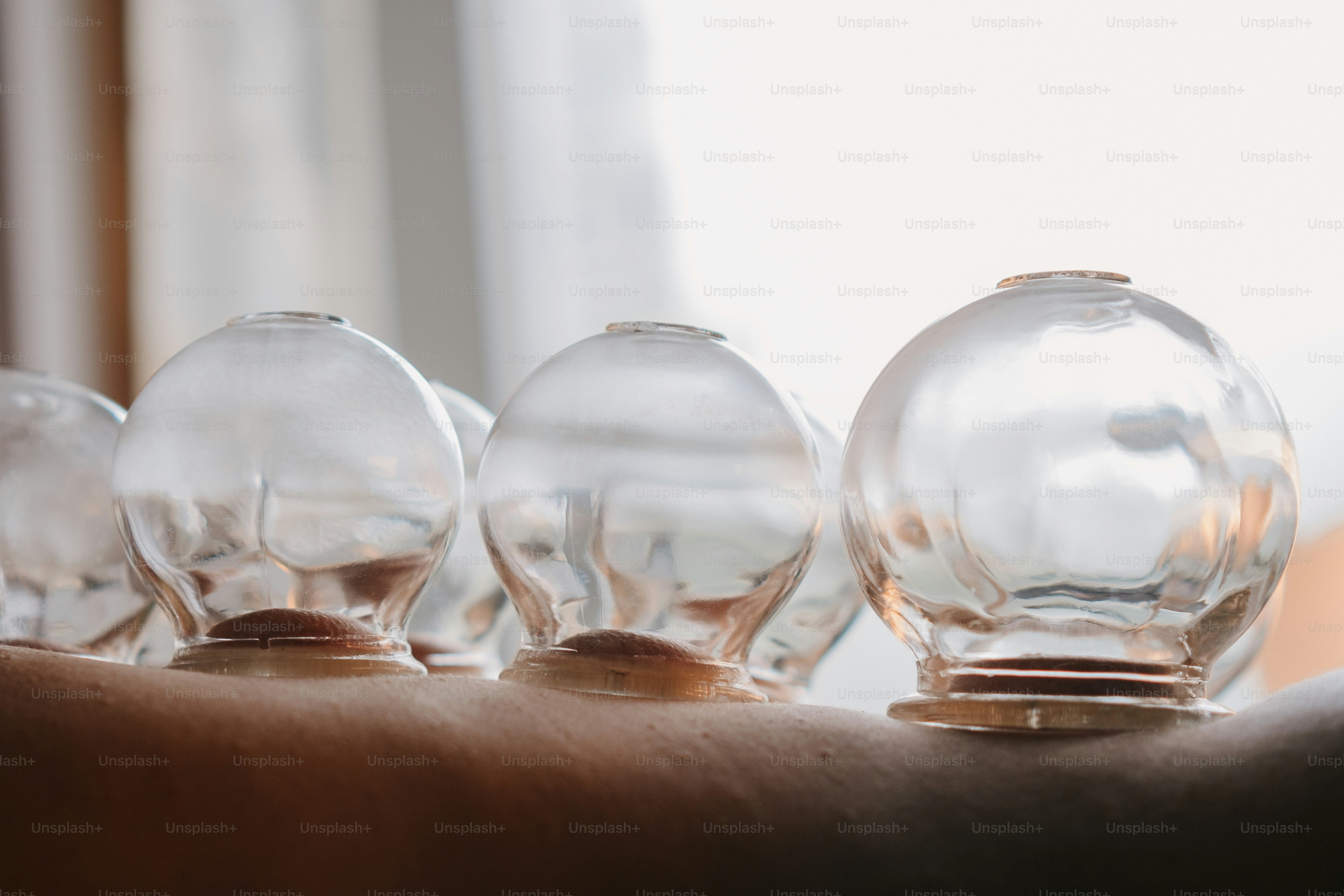 A group of glass vases sitting on top of a table photo – Health Image ...
