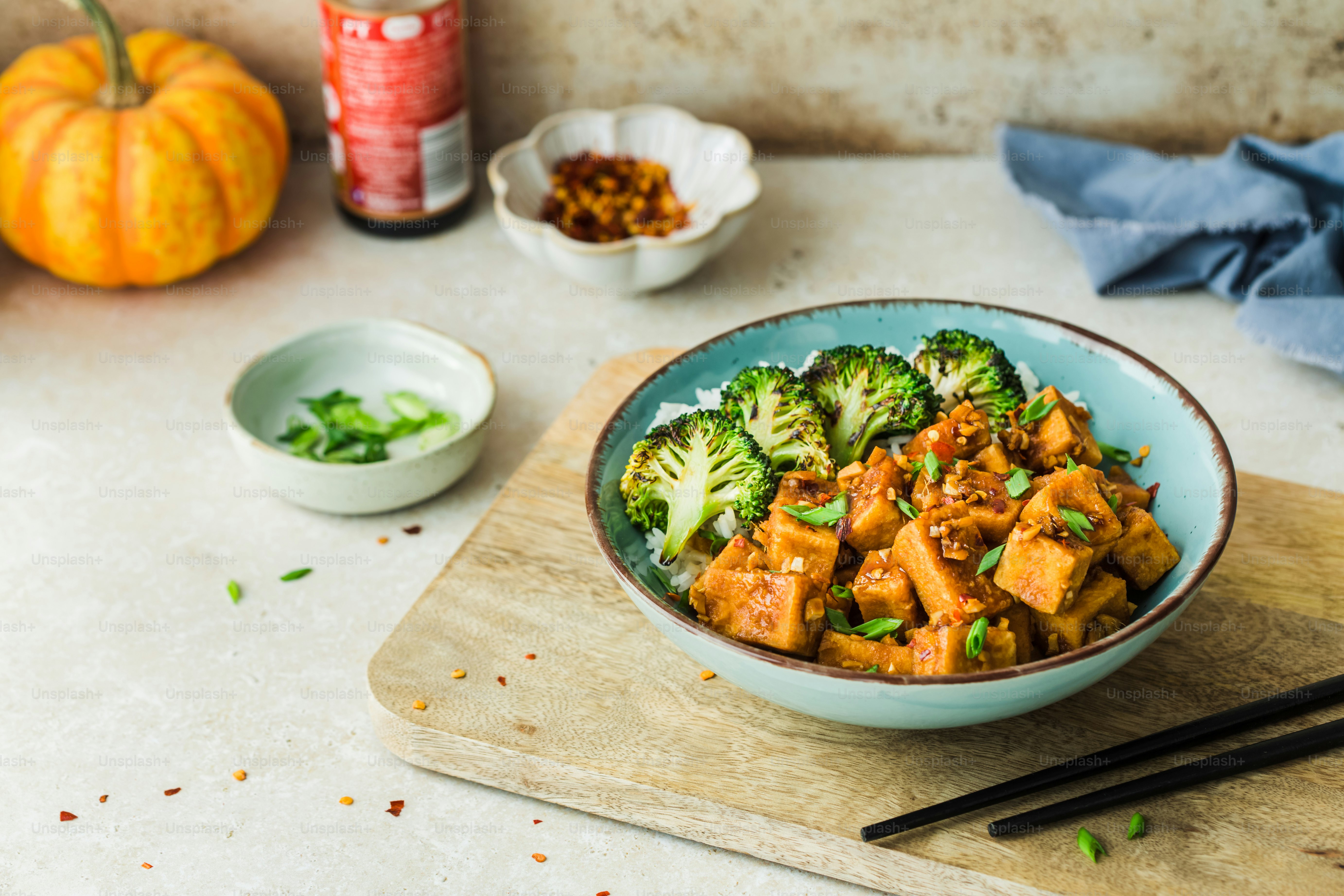 a bowl of food with broccoli and meat