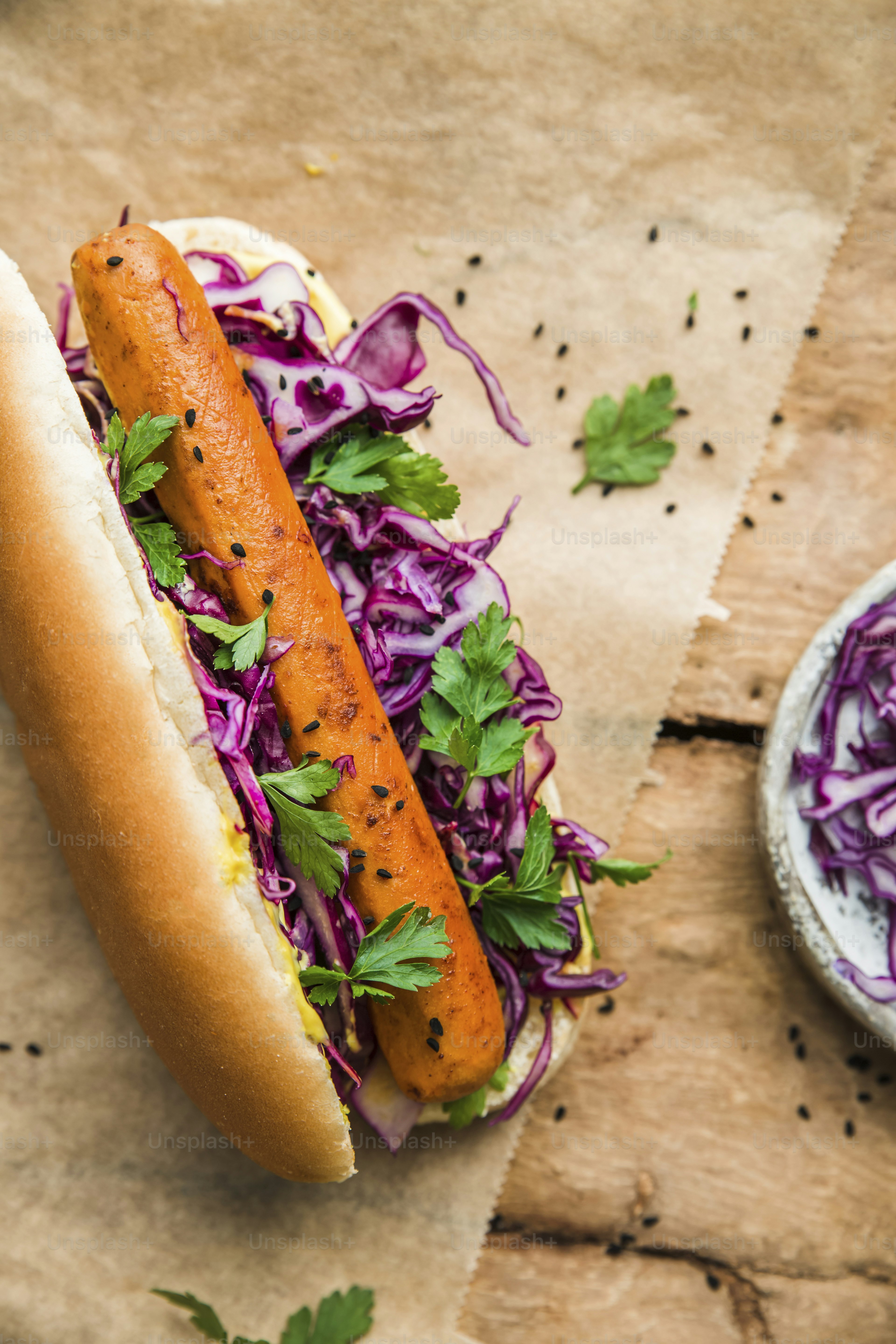 a hot dog on a bun with a side of coleslaw