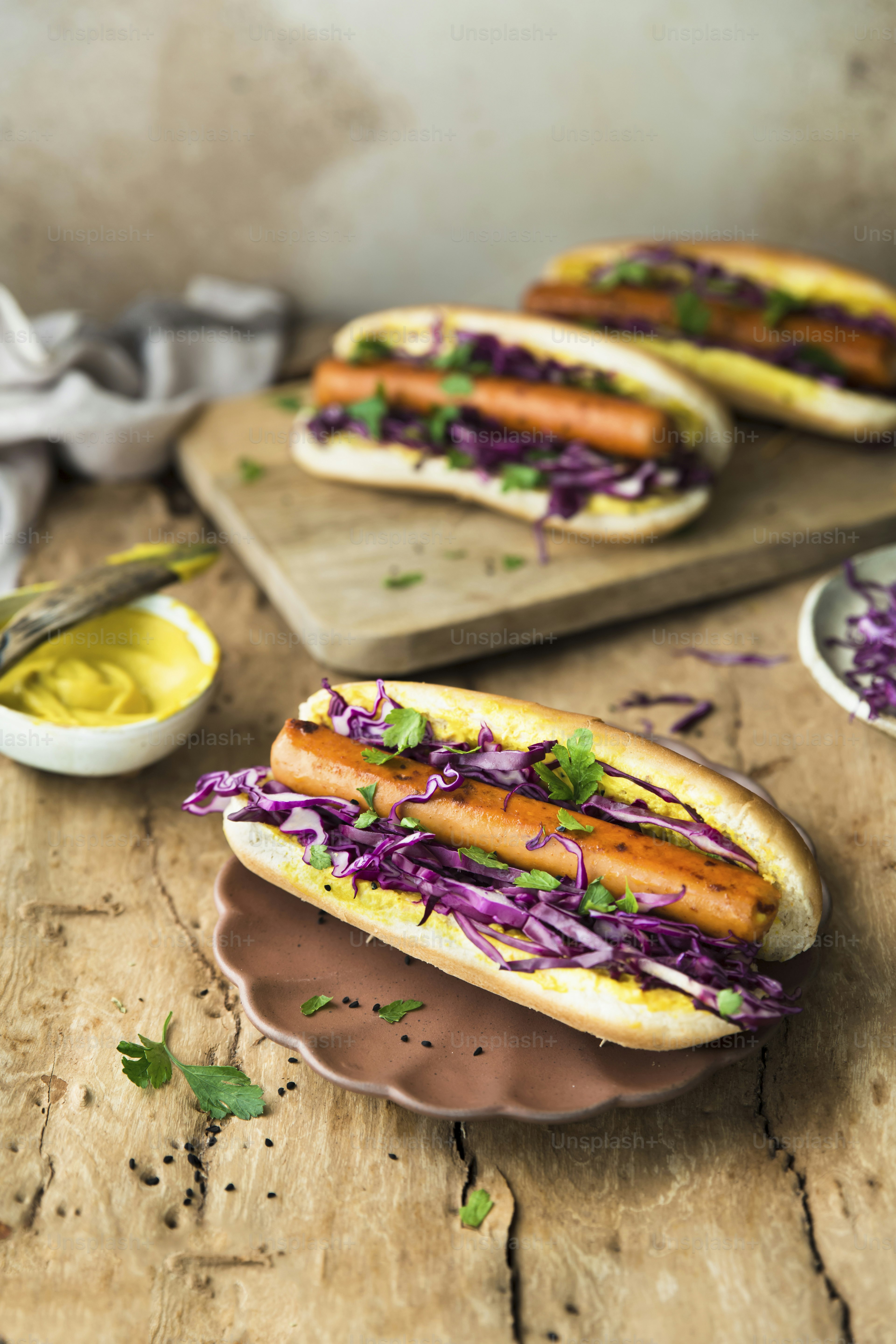 a couple of hot dogs sitting on top of a plate