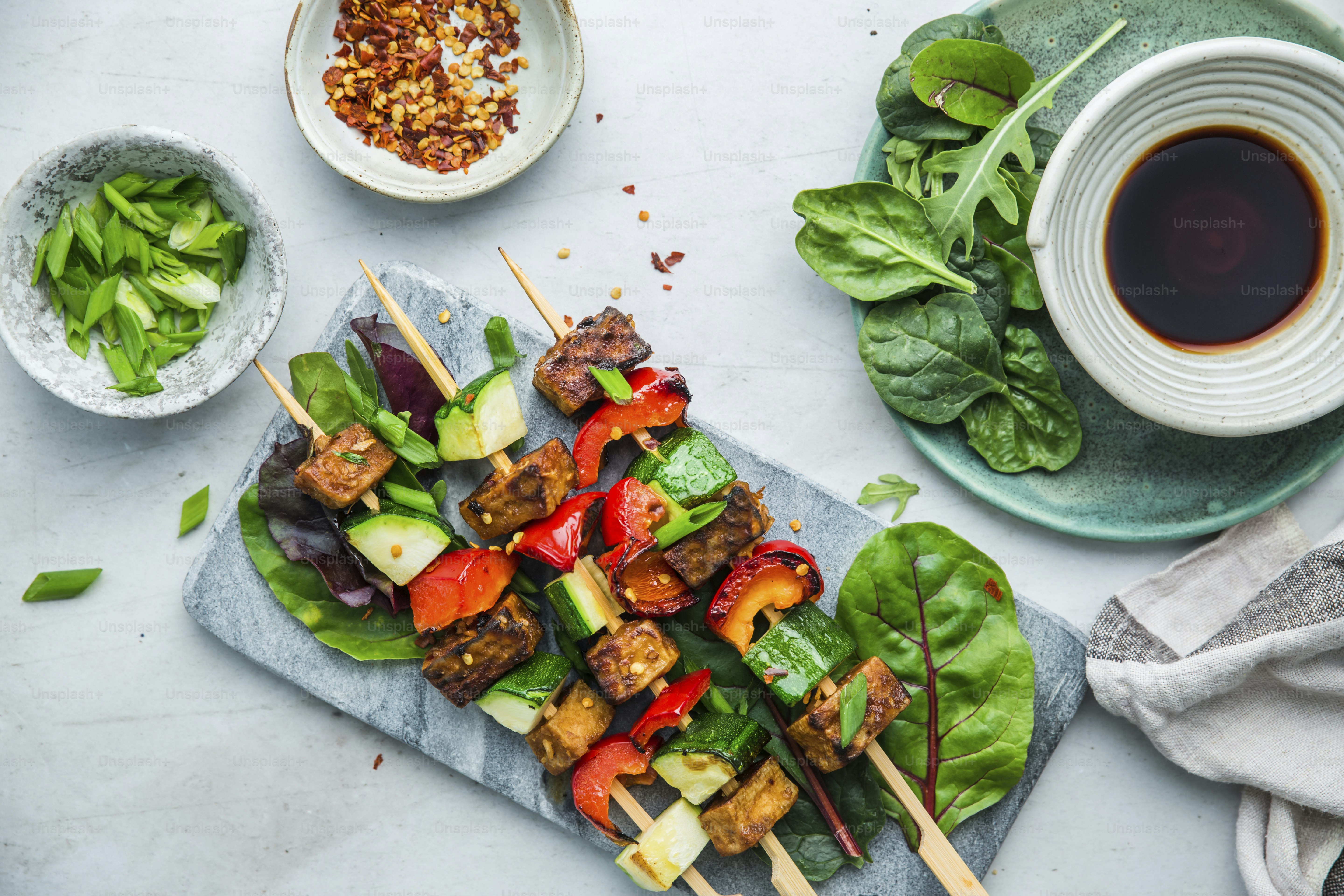 a table topped with plates of food and a cup of tea