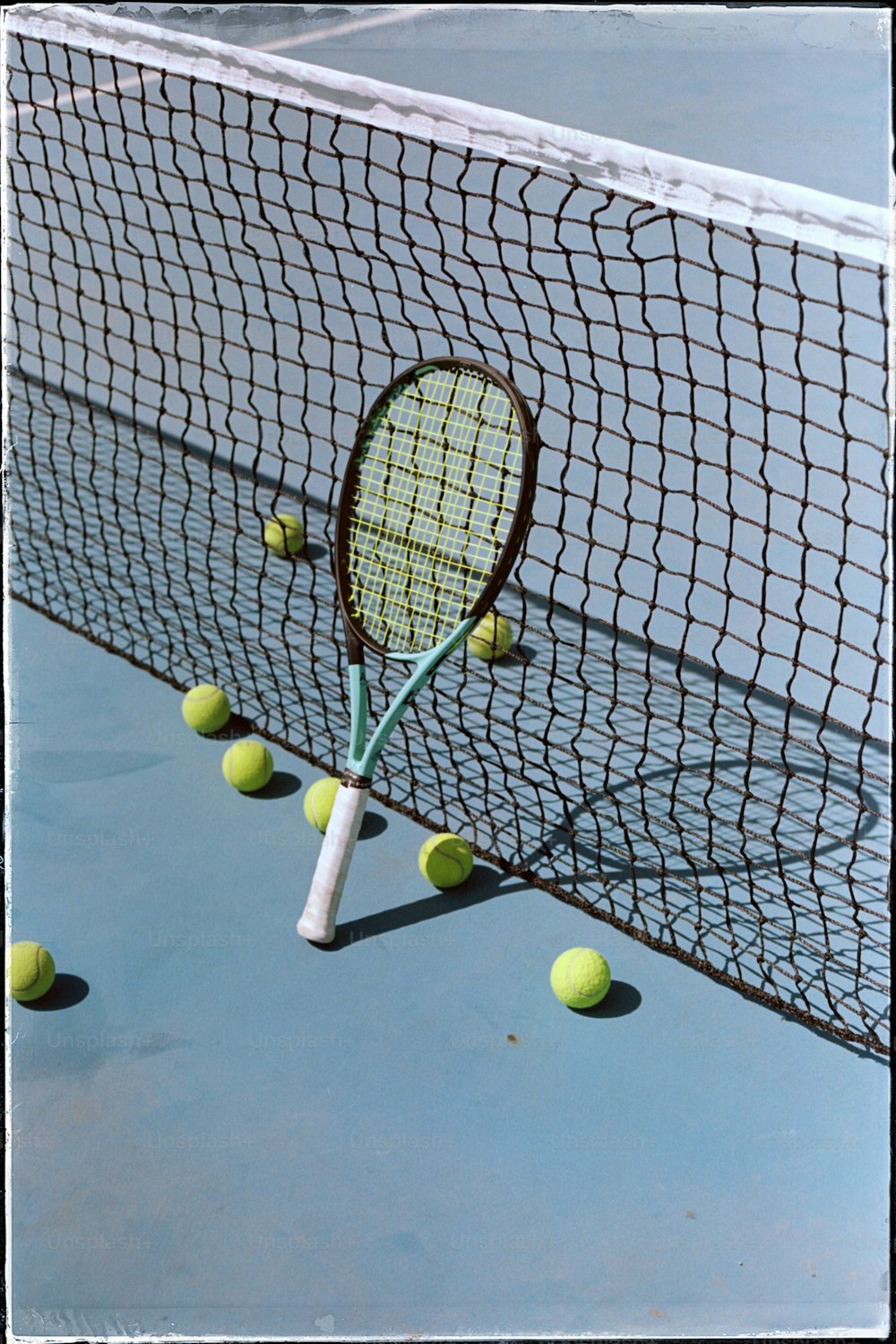 a tennis racket sticking out of the net
