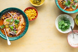 a table topped with bowls filled with different types of food