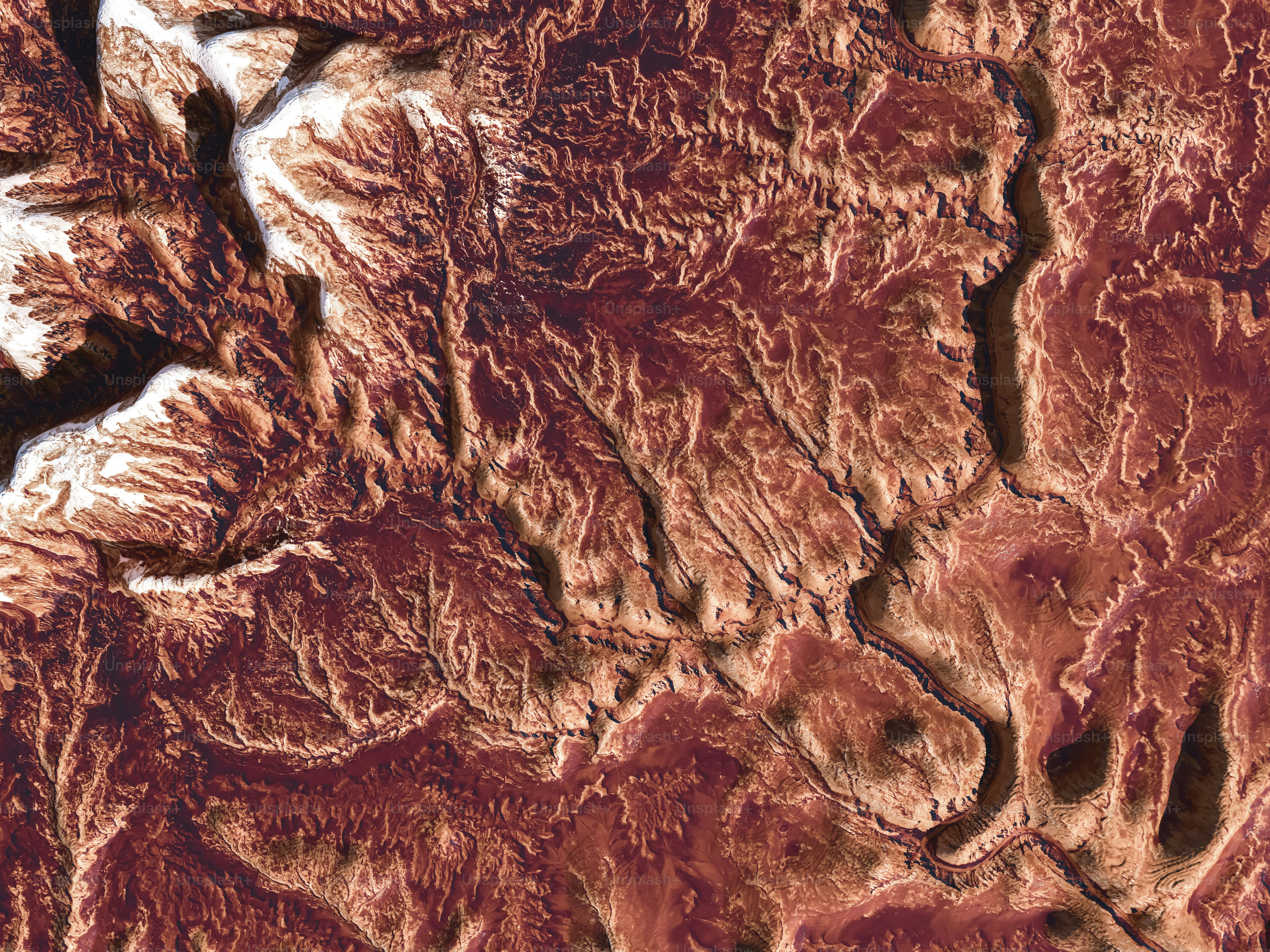 an aerial view of a mountain range in the desert