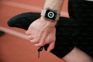 a close up of a person wearing a wrist watch