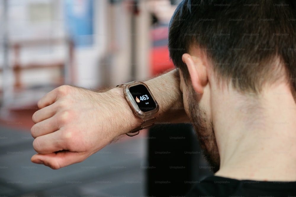 a man with a smart watch on his arm
