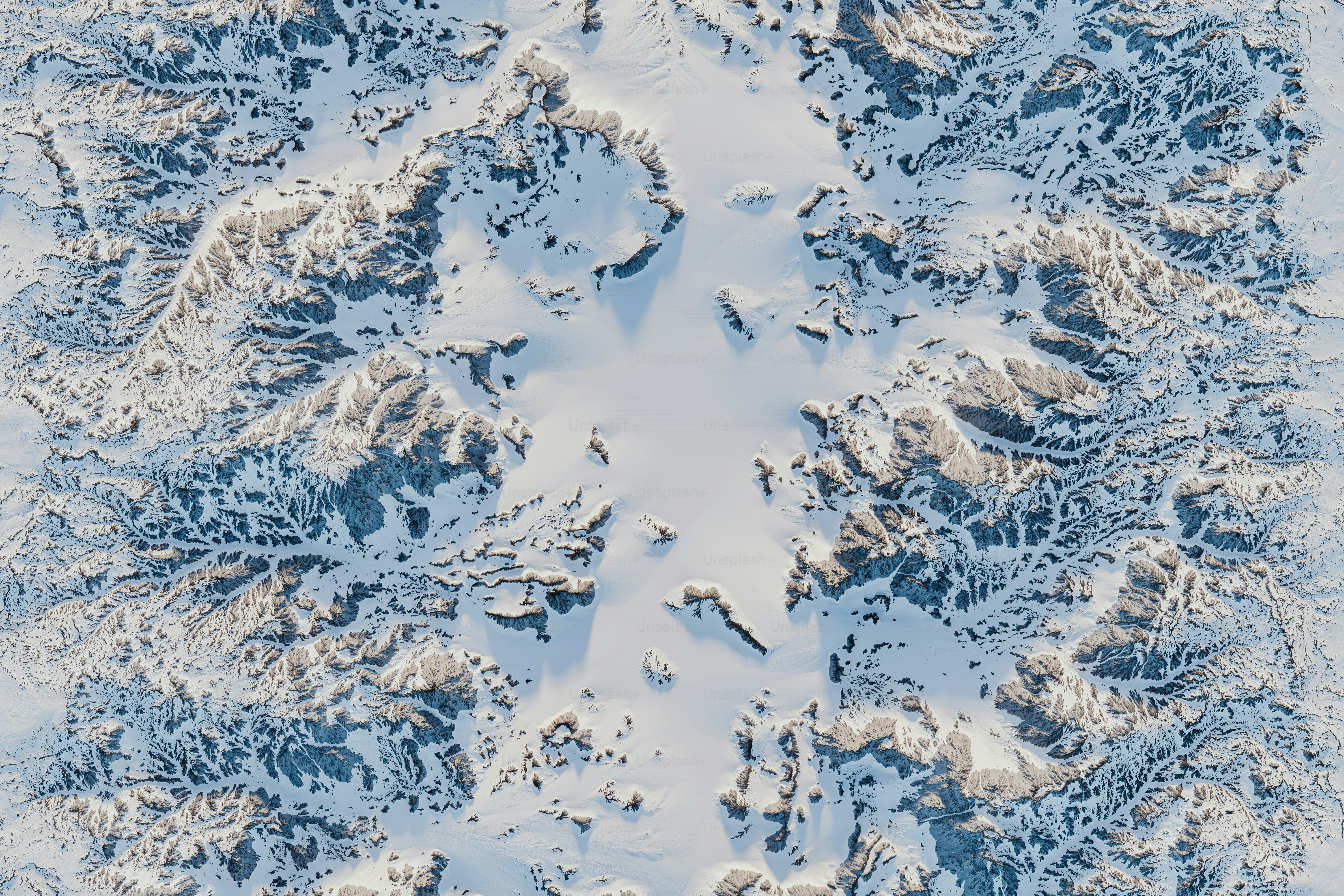 An aerial view of a snow covered mountain range photo – Landscape Image ...