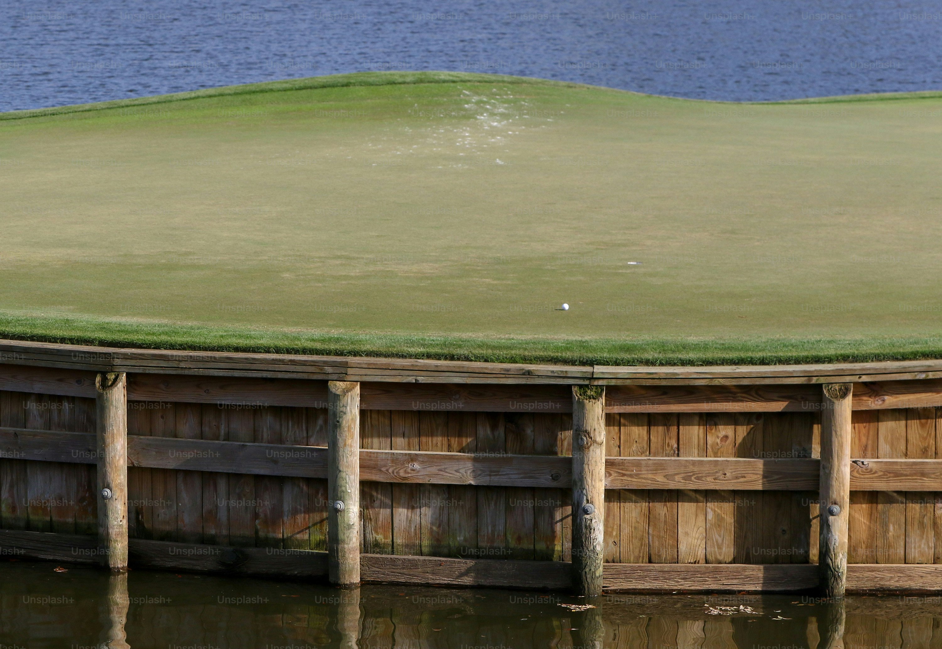 a large wooden structure sitting on top of a body of water
