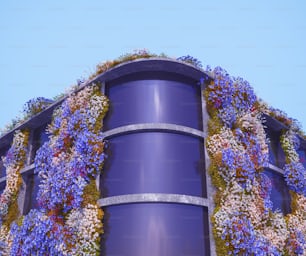a building covered in purple and white flowers