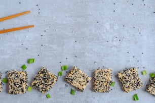 a number of crackers on a table with chopsticks