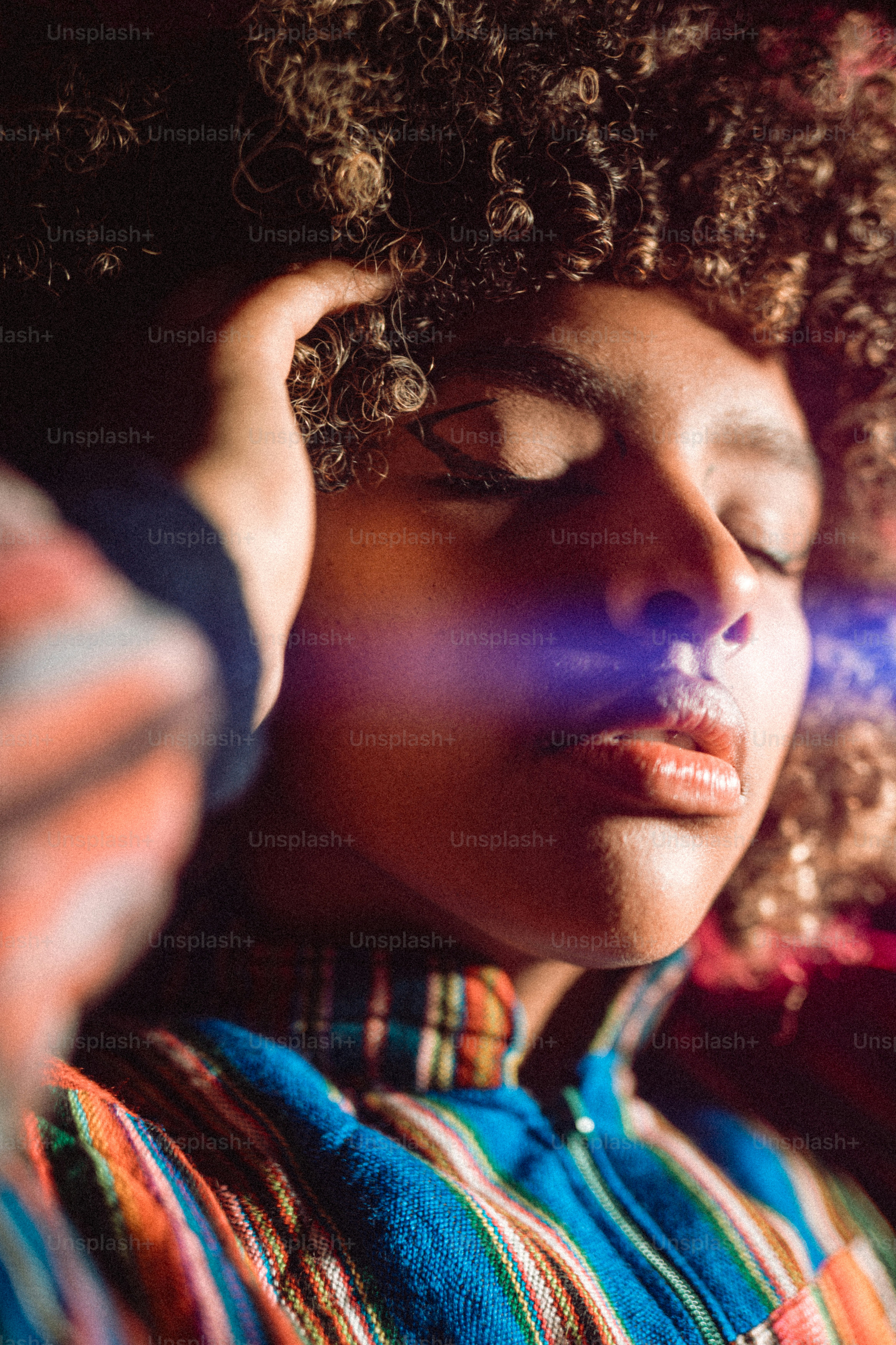 a close up of a person with curly hair