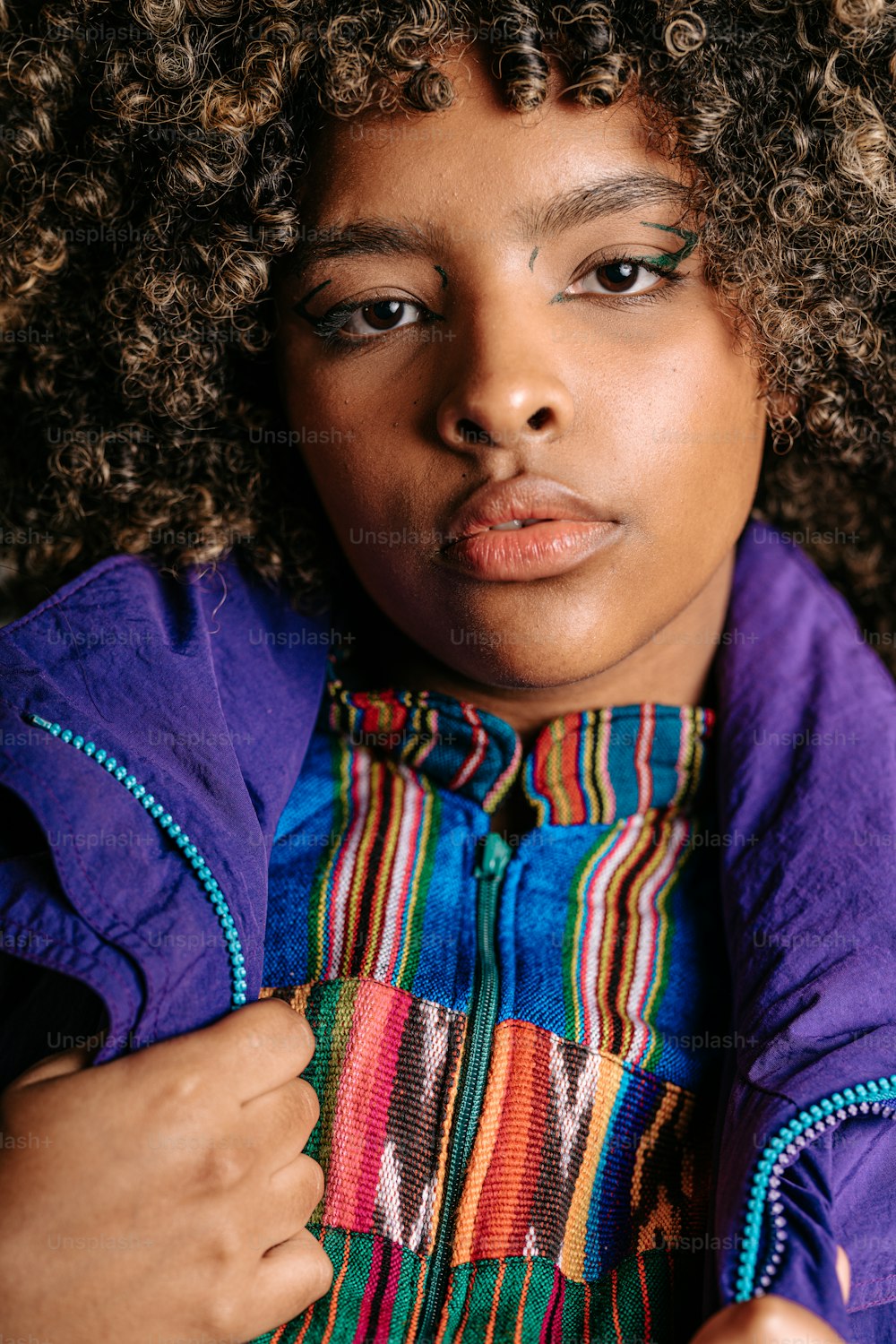 a close up of a person holding a piece of cloth