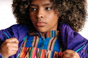 a close up of a person wearing a colorful jacket