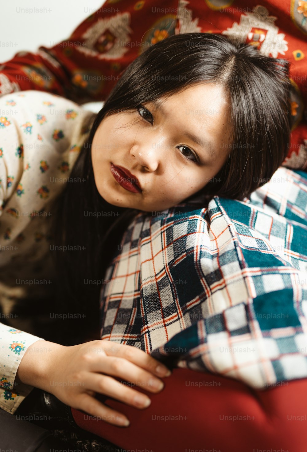 a young girl is wrapped up in a blanket
