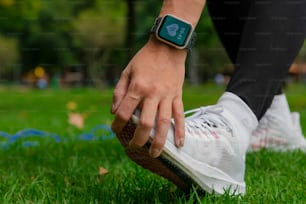 a close up of a person wearing a smart watch on their wrist