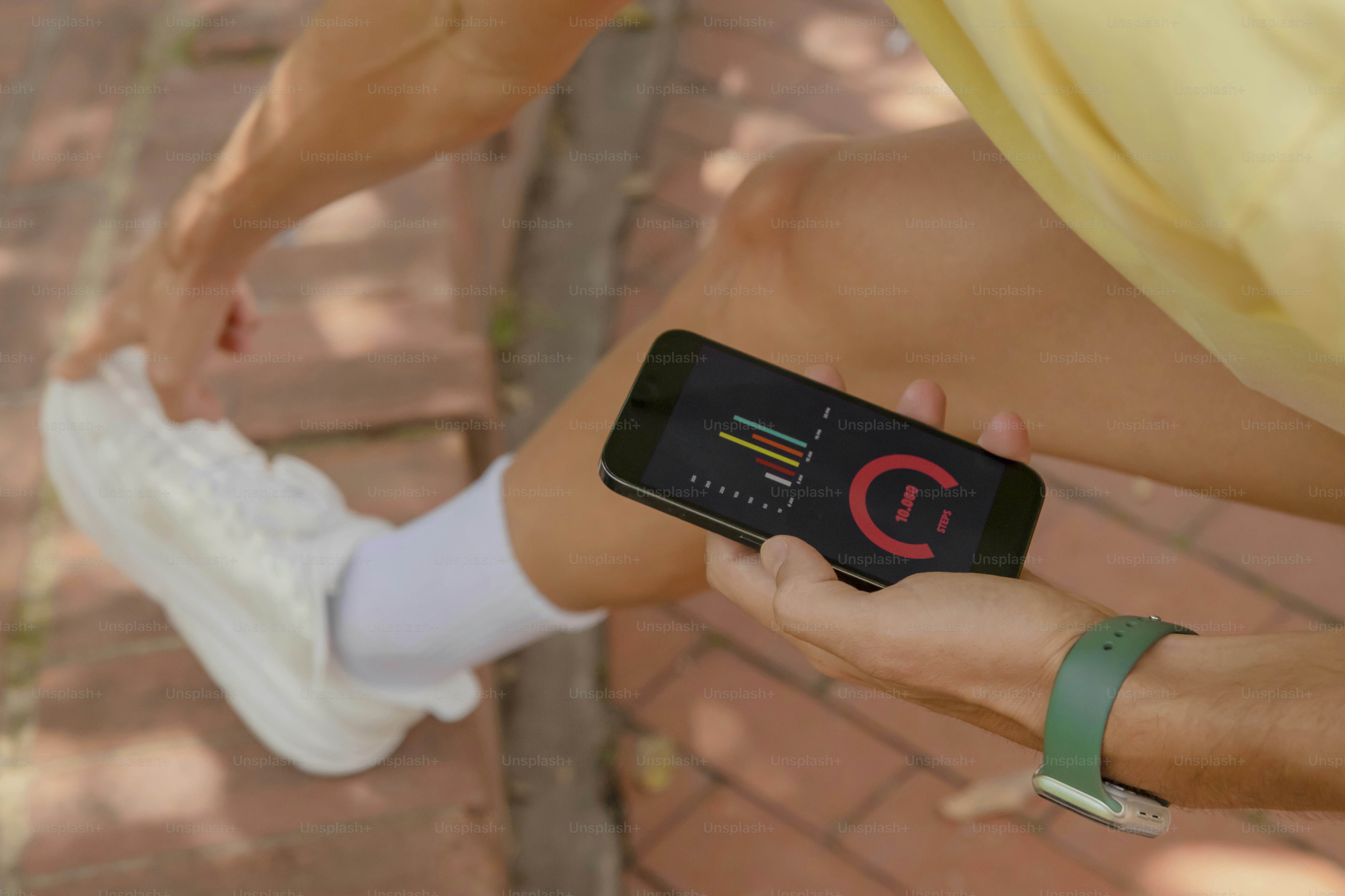 a person holding a smart phone in their hand