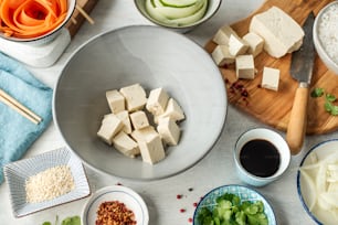 a table topped with bowls of food and chopsticks