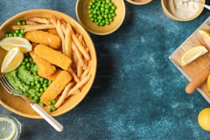 two bowls of food with peas, peas and lemons