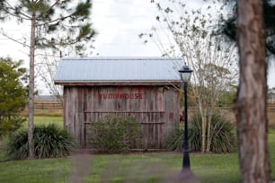 a barn with a sign on the side of it