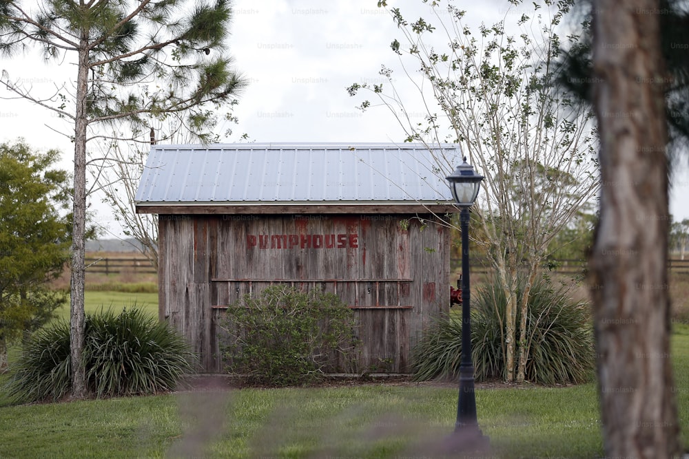 a barn with a sign on the side of it