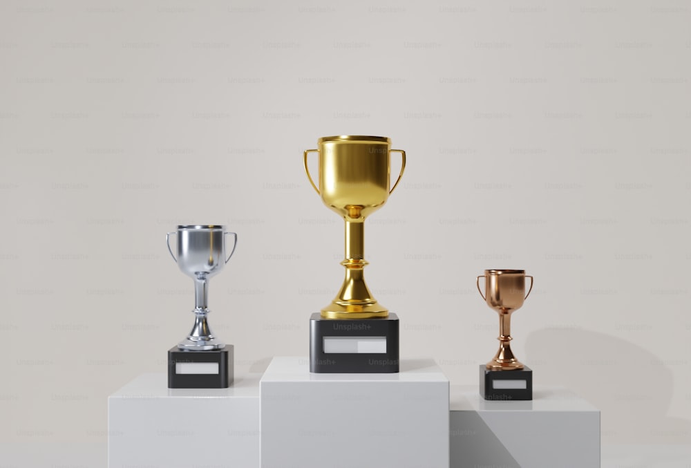 a row of three trophies sitting on top of each other