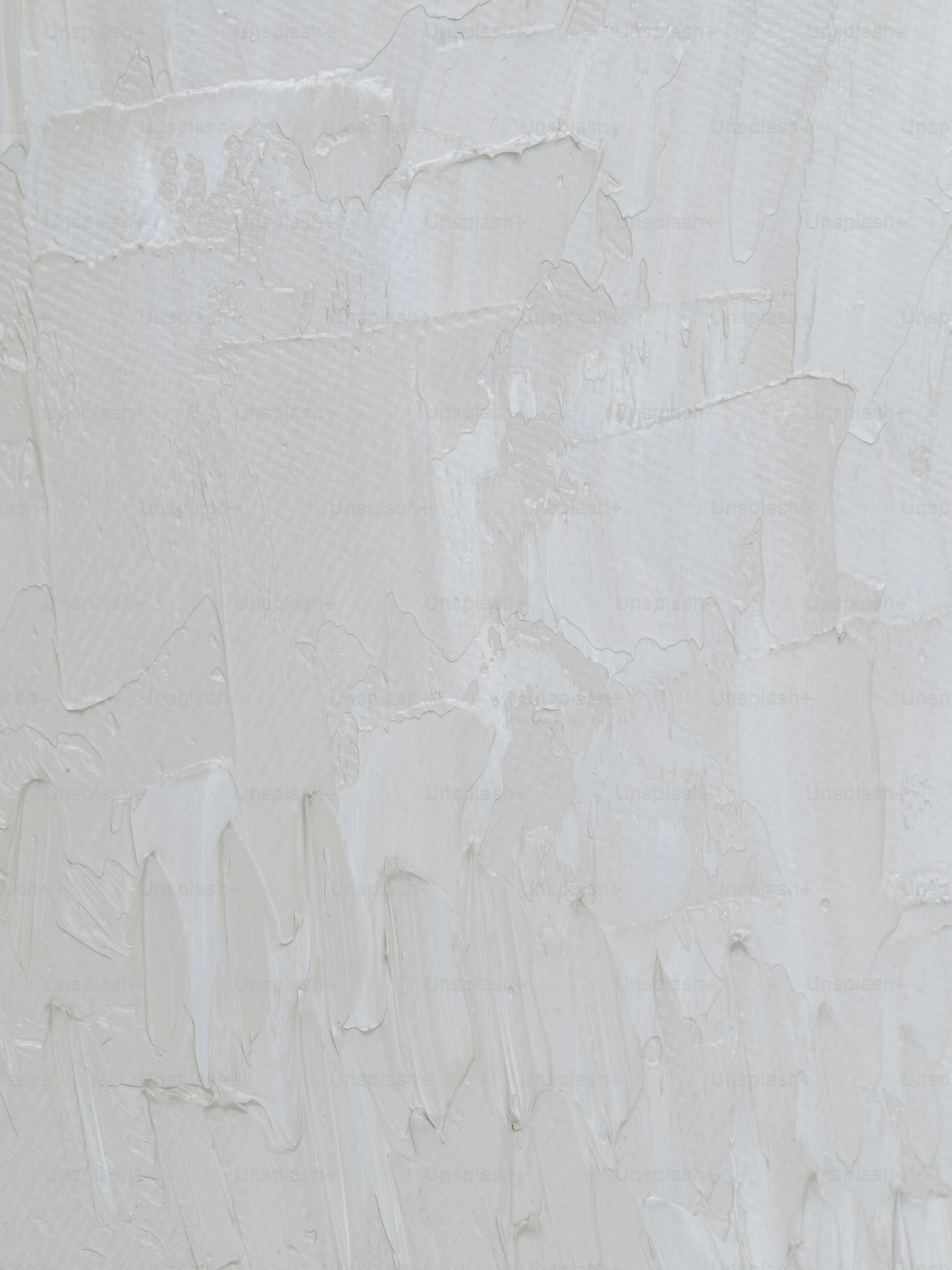 a man riding a snowboard down a snow covered slope