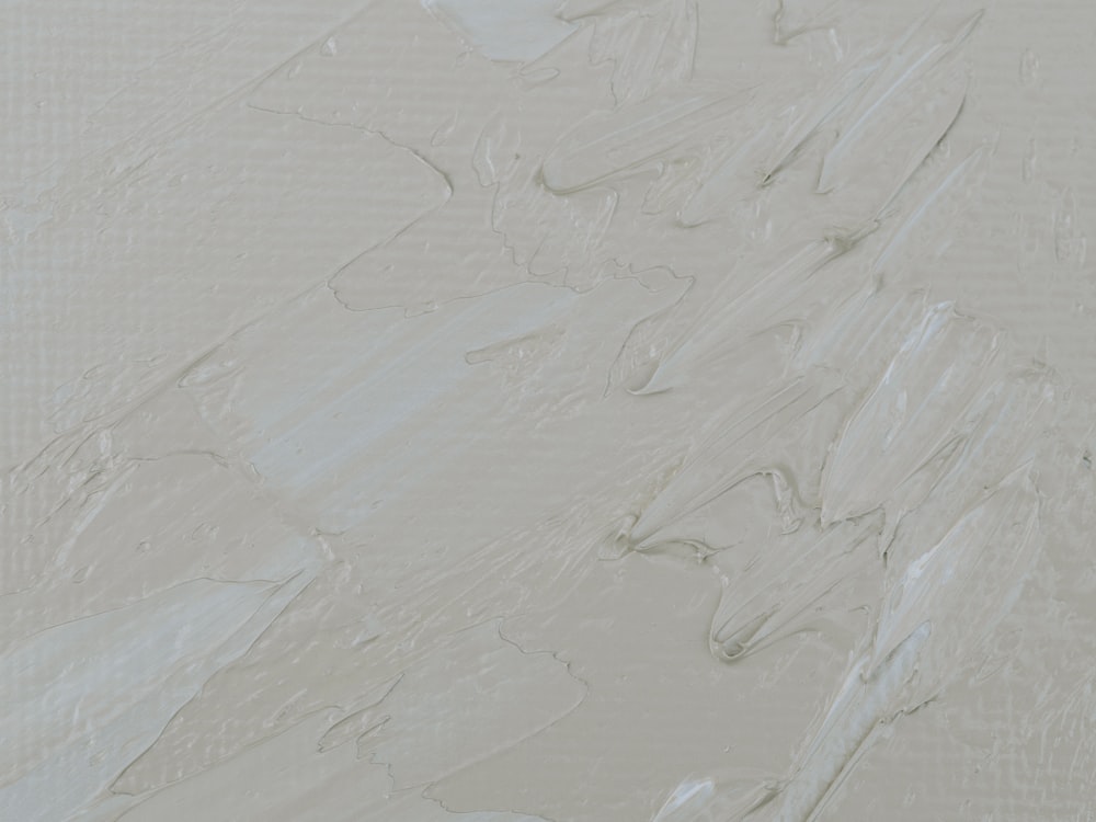 a painting of white paint on a wall