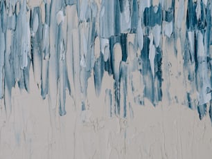 a painting of blue and white paint on a wall