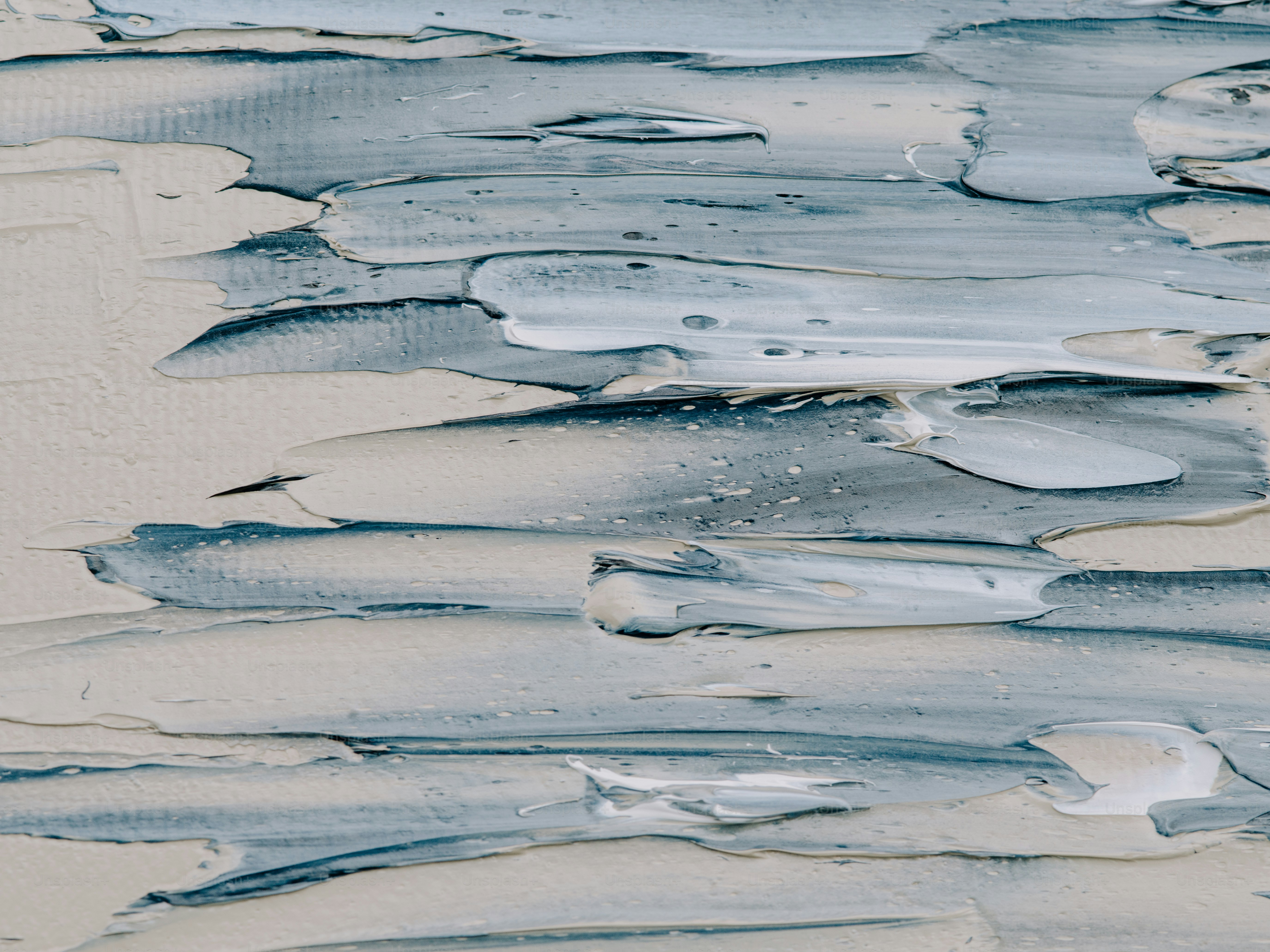 a close up of water and sand on a beach