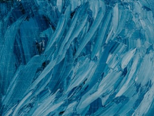 an abstract painting of blue and white paint