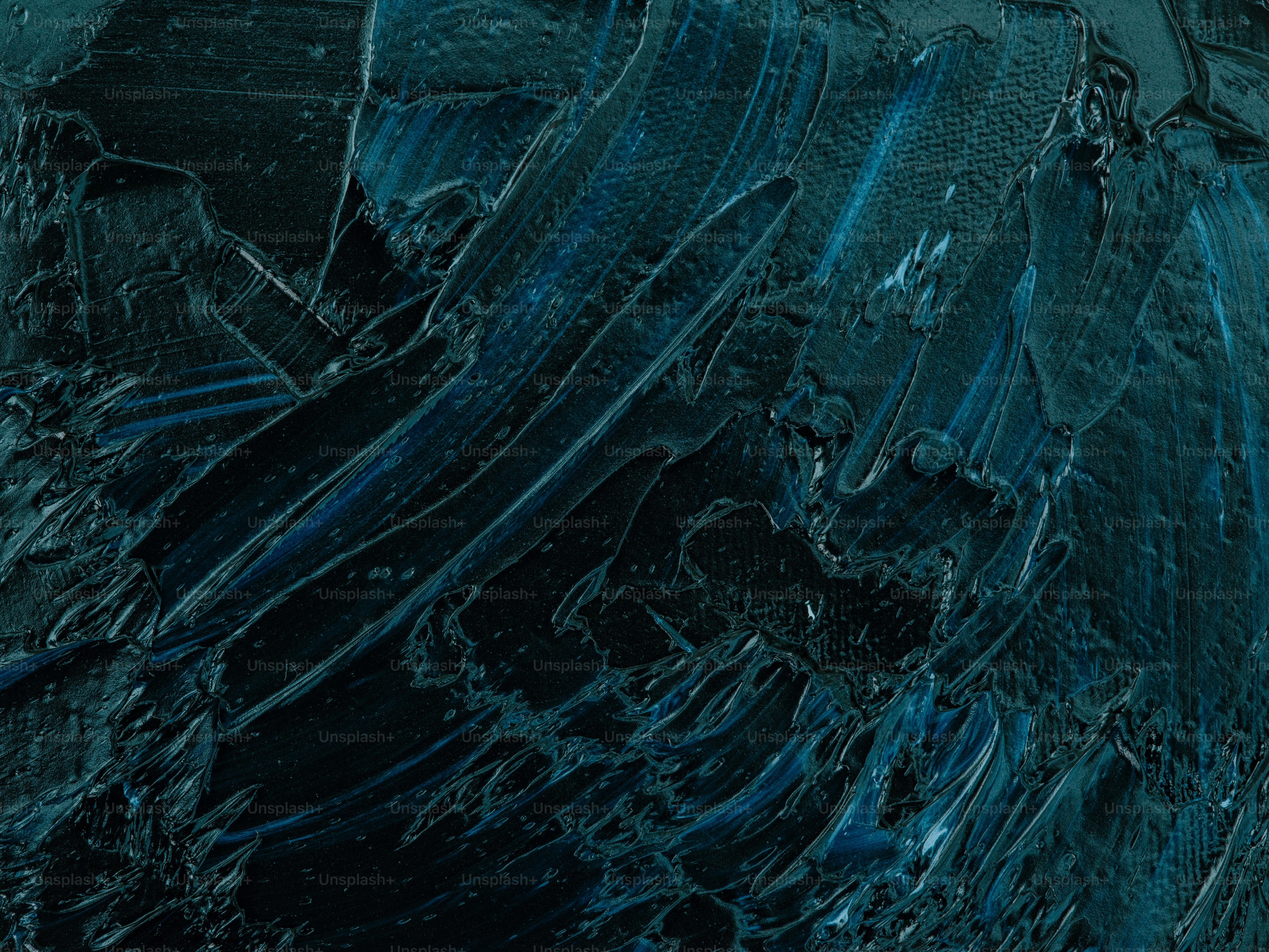 a close up of a black and blue abstract painting